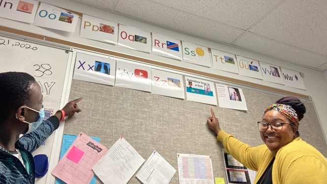 Christina Spencer and Valentino working on the alphabet. Christina Spencer and Valentino working on the alphabet.