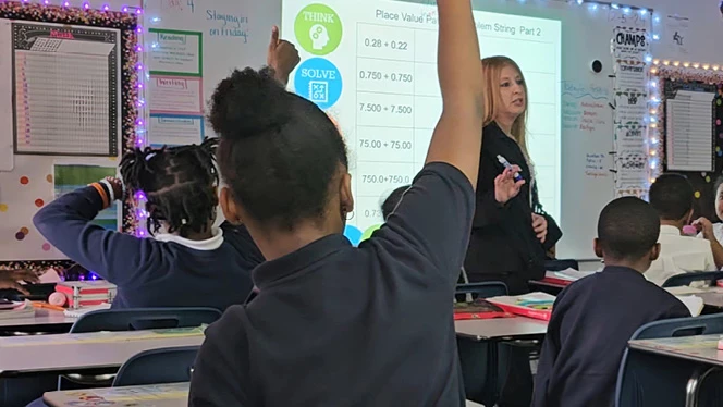K-8 School in Southfield: Ms. Winter, a fifth-grade teacher at Laurus Academy, teaches her math class.