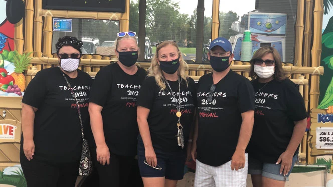 Teachers smiling for the camera