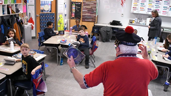 American legion member speaking to students