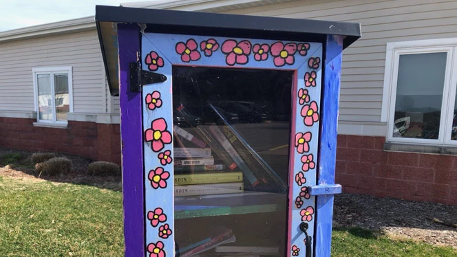 Lending library outside of school building