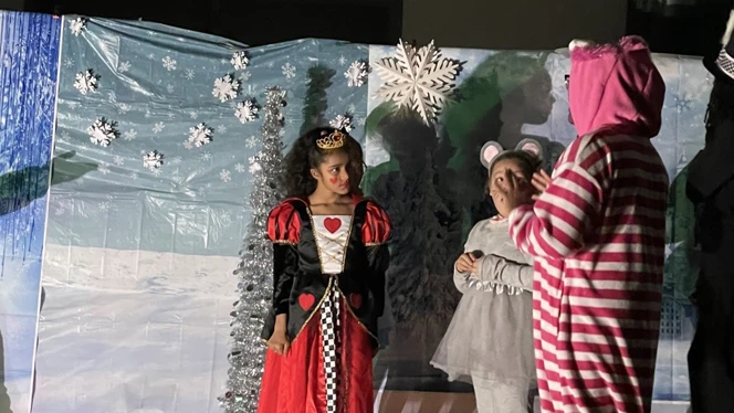 Students performing in the play. Students performing in the play.
