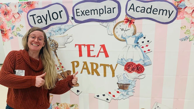 Woman standing next to the Tea Party sign. Woman standing next to the Tea Party sign.