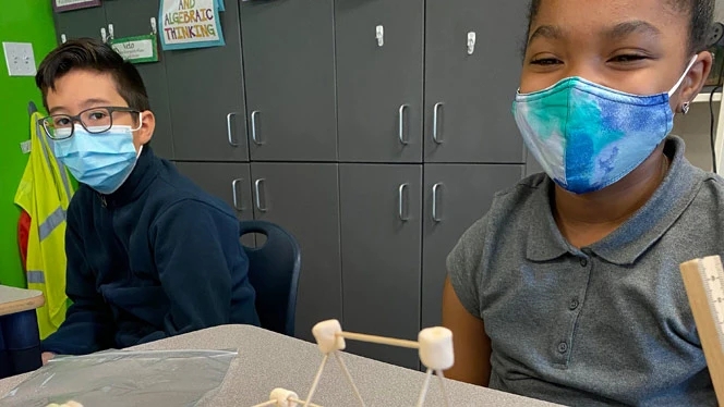 Two students with their marshmallow and stick structure. Two students with their marshmallow and stick structure.