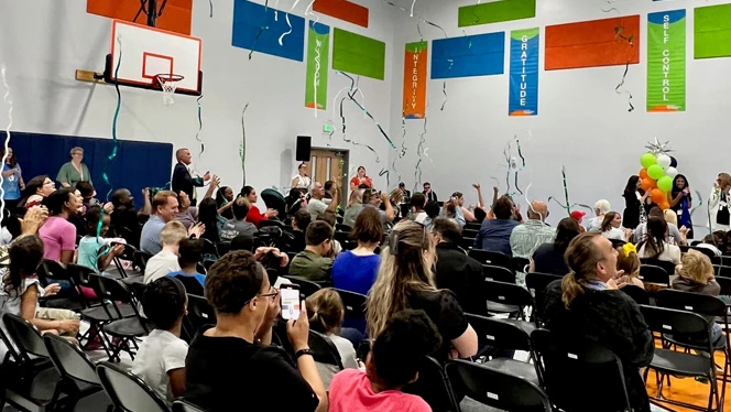 Families at ribbon cutting.