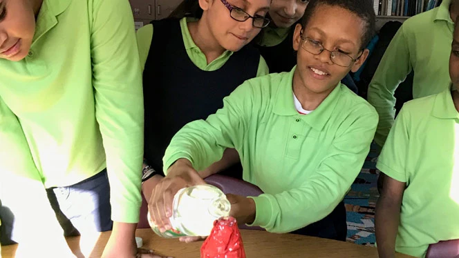Student pouring water