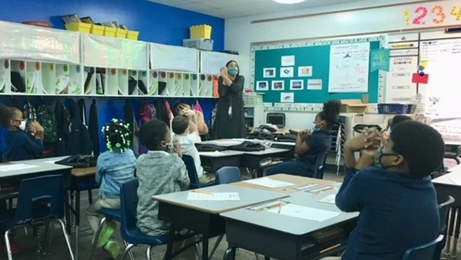 Lauren Marcoux presenting to her class.