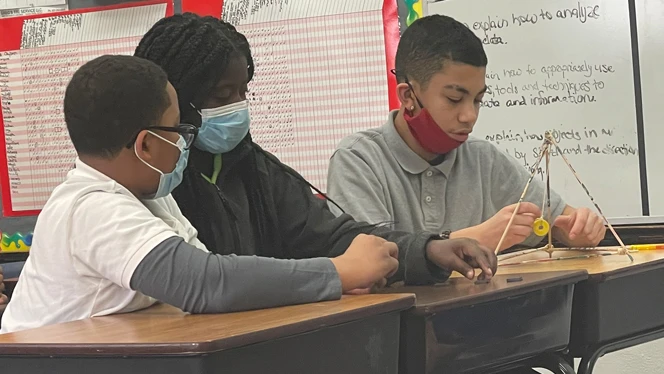 Emerson students working on a science experiment