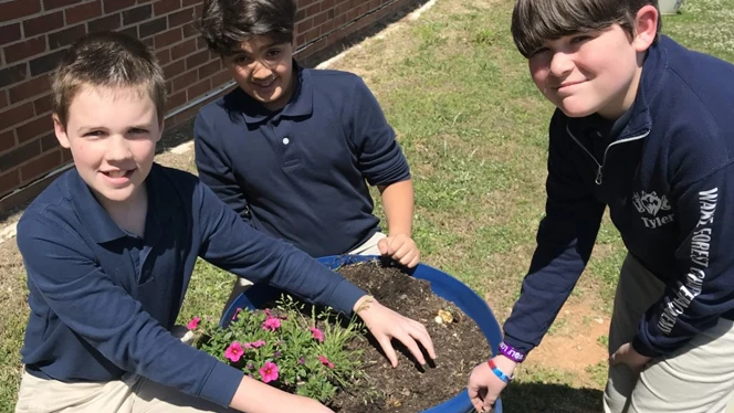 Children planting flowers. Children planting flowers.