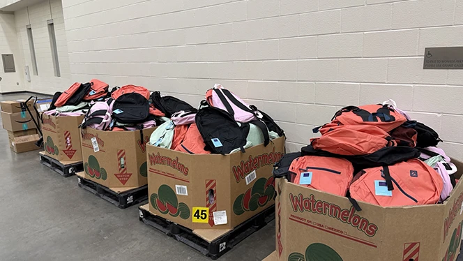 Charter Schools in Grand Rapids: National Heritage Academies partnered with In The Image Shoes Event to provide a pair of shoes to students.