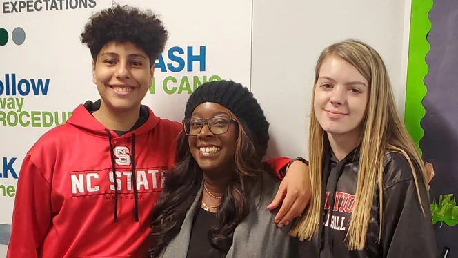 Kenee Reddick smiles with students