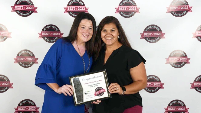 Winterville Charter Academy Principal Annastasia Ryan and Dean of Lower Elementary Sofia Sourgiadakis-Baklarz accepted the award.
