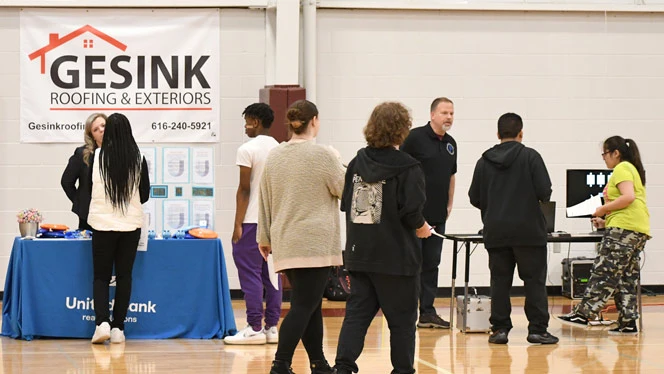 Wellspring Prep students walking around career fair.