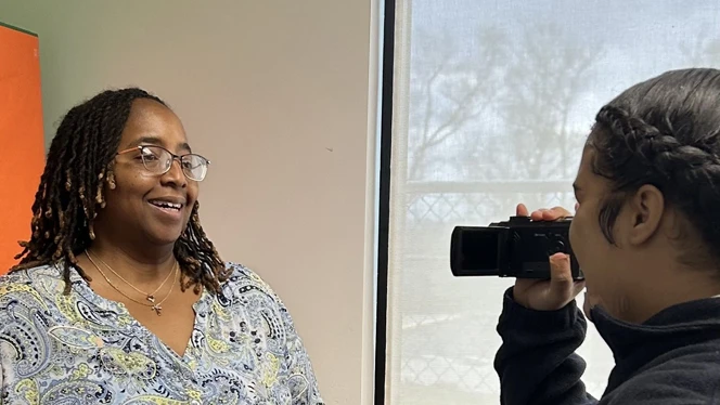 Teacher talking on camera.