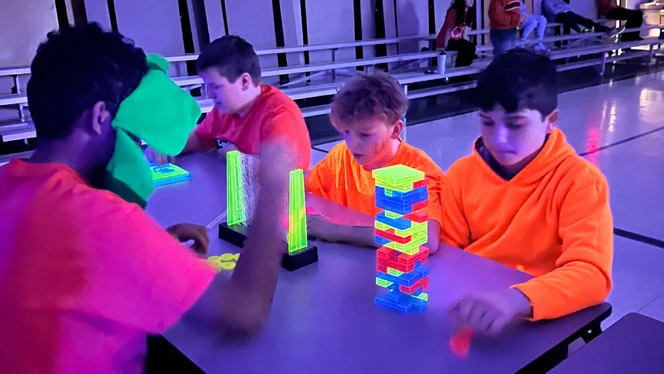 Students playing glow games.