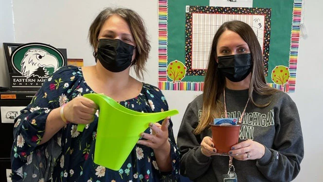 teachers watering the plants teachers watering the plants