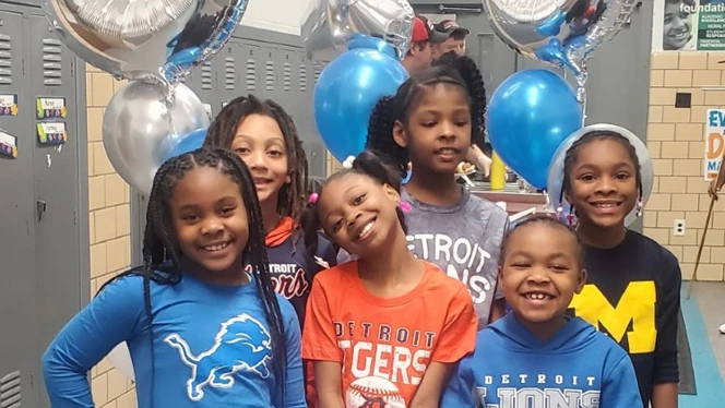 Children wearing Detroit themed clothing. Children wearing Detroit themed clothing.
