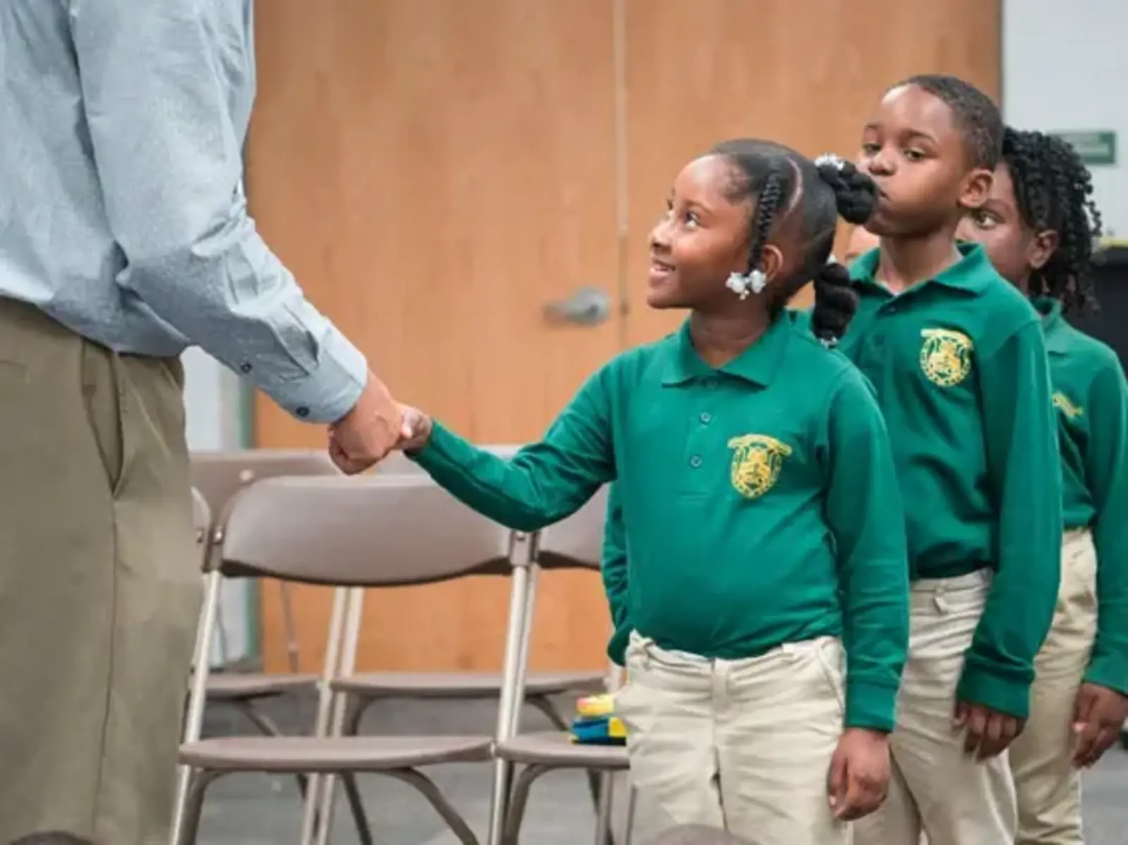Student shaking teacher's hand