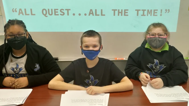 Students learning at a table