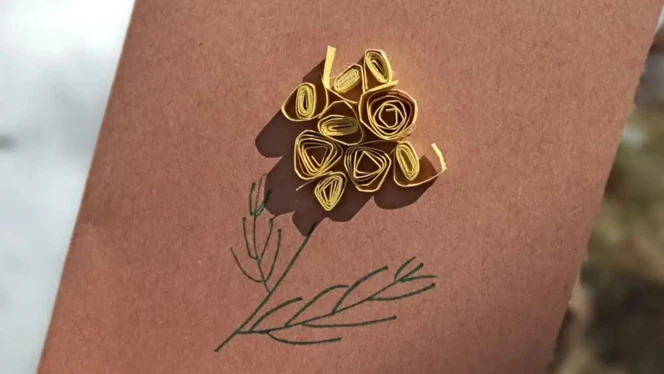 A card with a flower on it made by a student. A card with a flower on it made by a student.