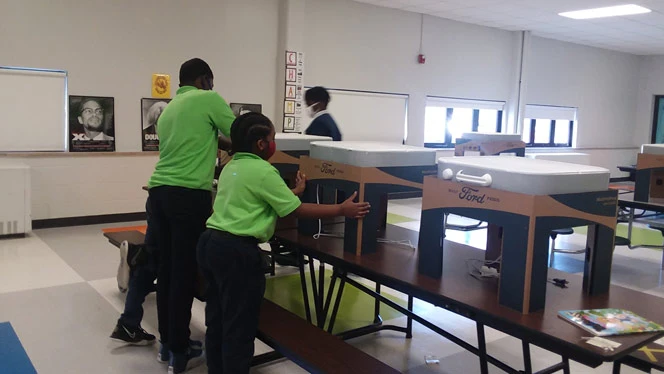 Students assembling air filtration systems