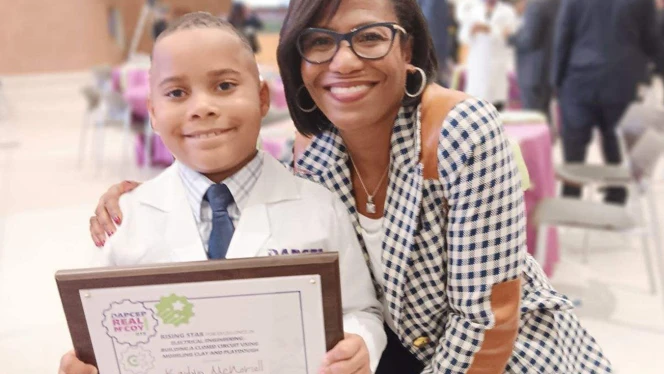 Kaidyn McNoriell with DTE President.