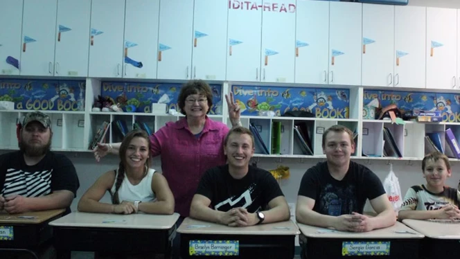 Adults sitting at desks with Mrs Halka. Adults sitting at desks with Mrs Halka.