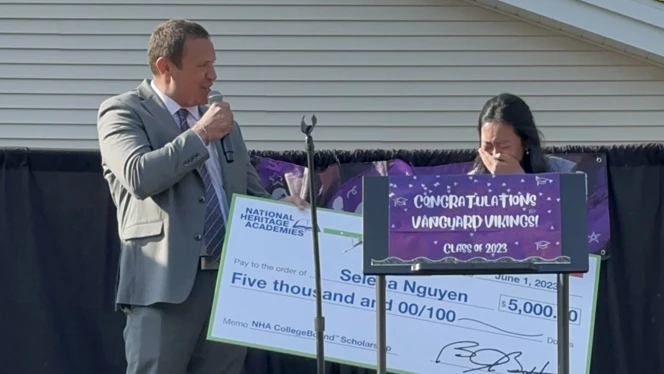 Selena Nguyen accepting her scholarship.
