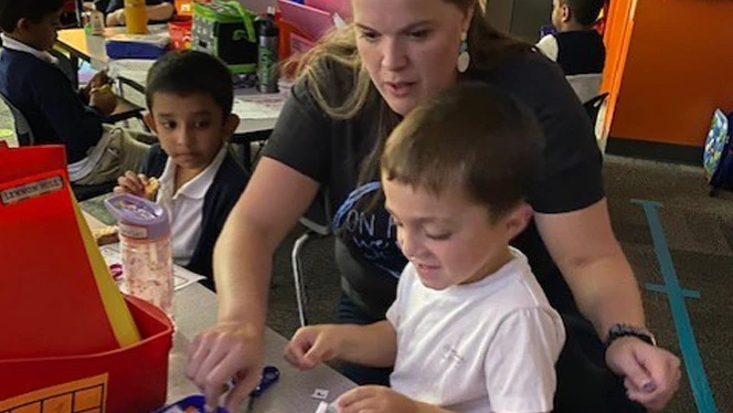 Lauren Matherly instructing one of her kindergarten scholars. Lauren Matherly instructing one of her kindergarten scholars.