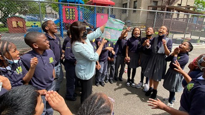 Group of students with butterflies.