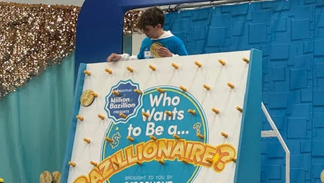 Landmark student playing Plinko.