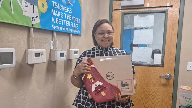 Teacher with laptop.