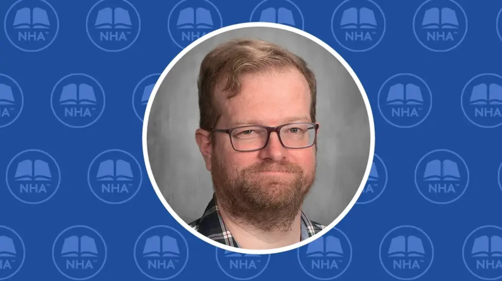 a man with glasses and beard