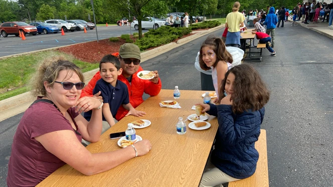 family eating international food