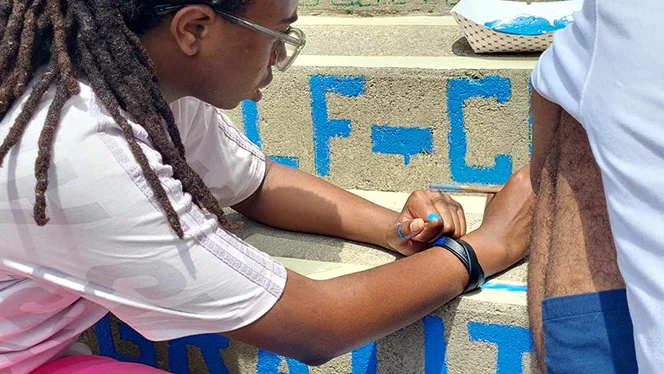 K-8 School in East Cleveland: Apex Academy Art Club and Art Teacher painted Moral Focus virtues on the school's back steps as part of a summer break project.