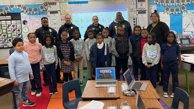 Students standing with police officers. Students standing with police officers.