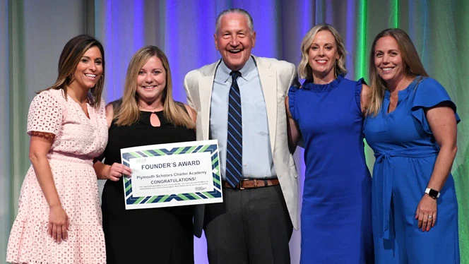National Heritage Academies: JC Huizenga poses with Founder's Award-winning Plymouth Scholars leadership team.