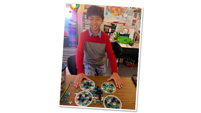Endeavor student with his handmade suncatchers