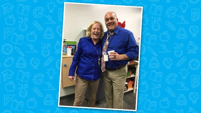 Hower holding coffee and smiling with a woman.