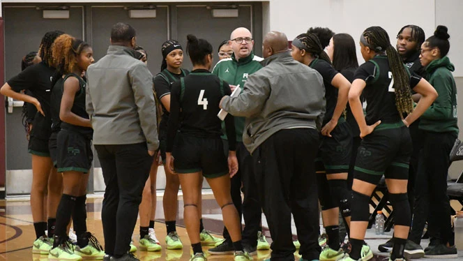 Coach talks with team during time out