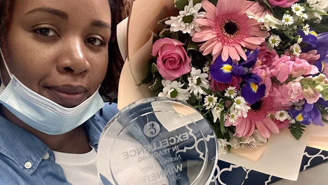 Nickiesha Grey with flowers