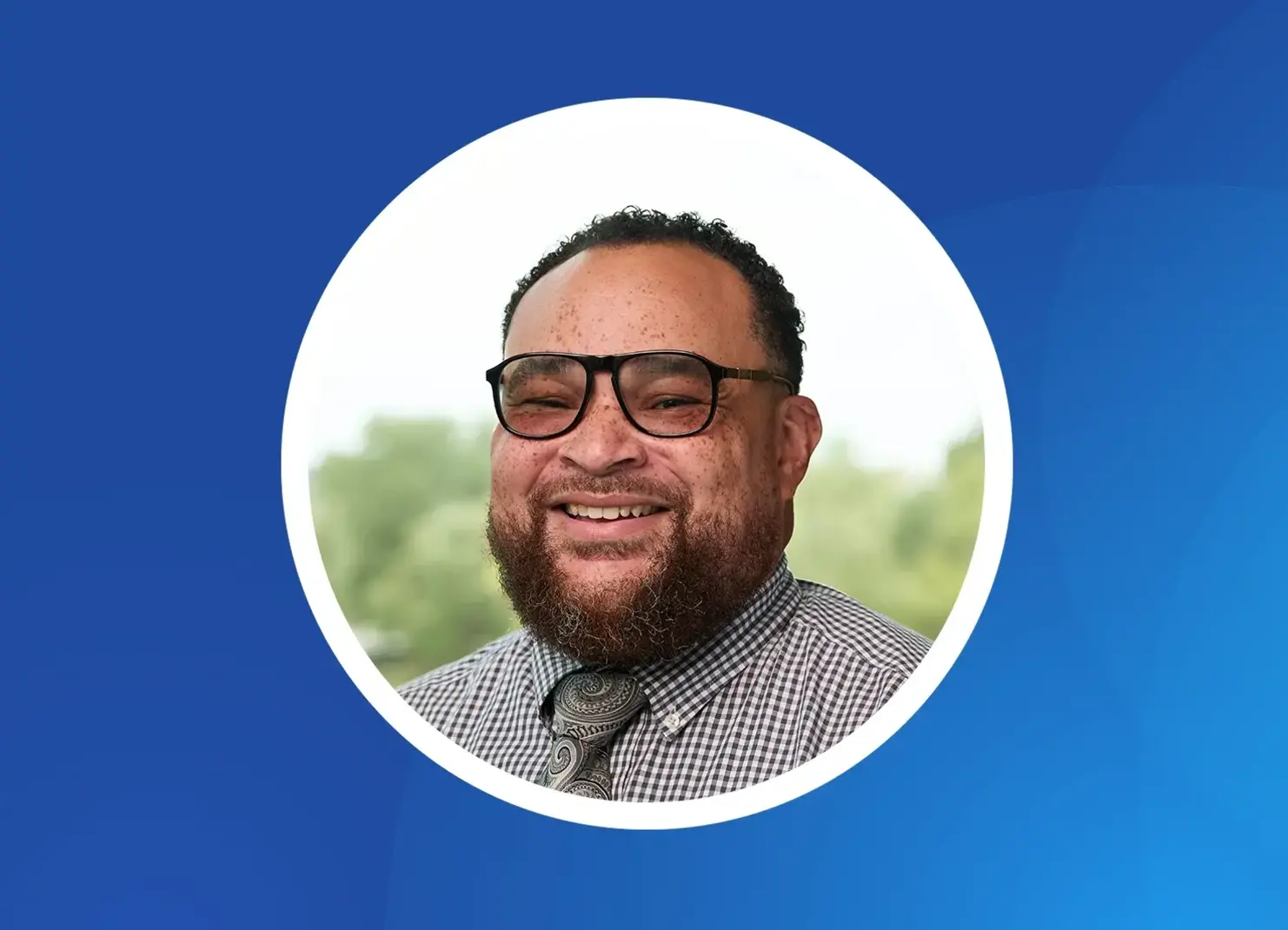 a man with a beard wearing glasses