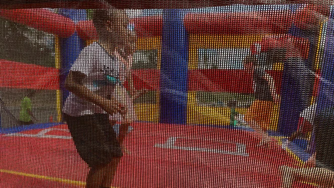 Students in a bounce castle. Students in a bounce castle.