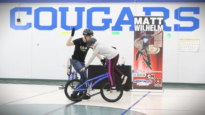 Wilhelm with student on bike