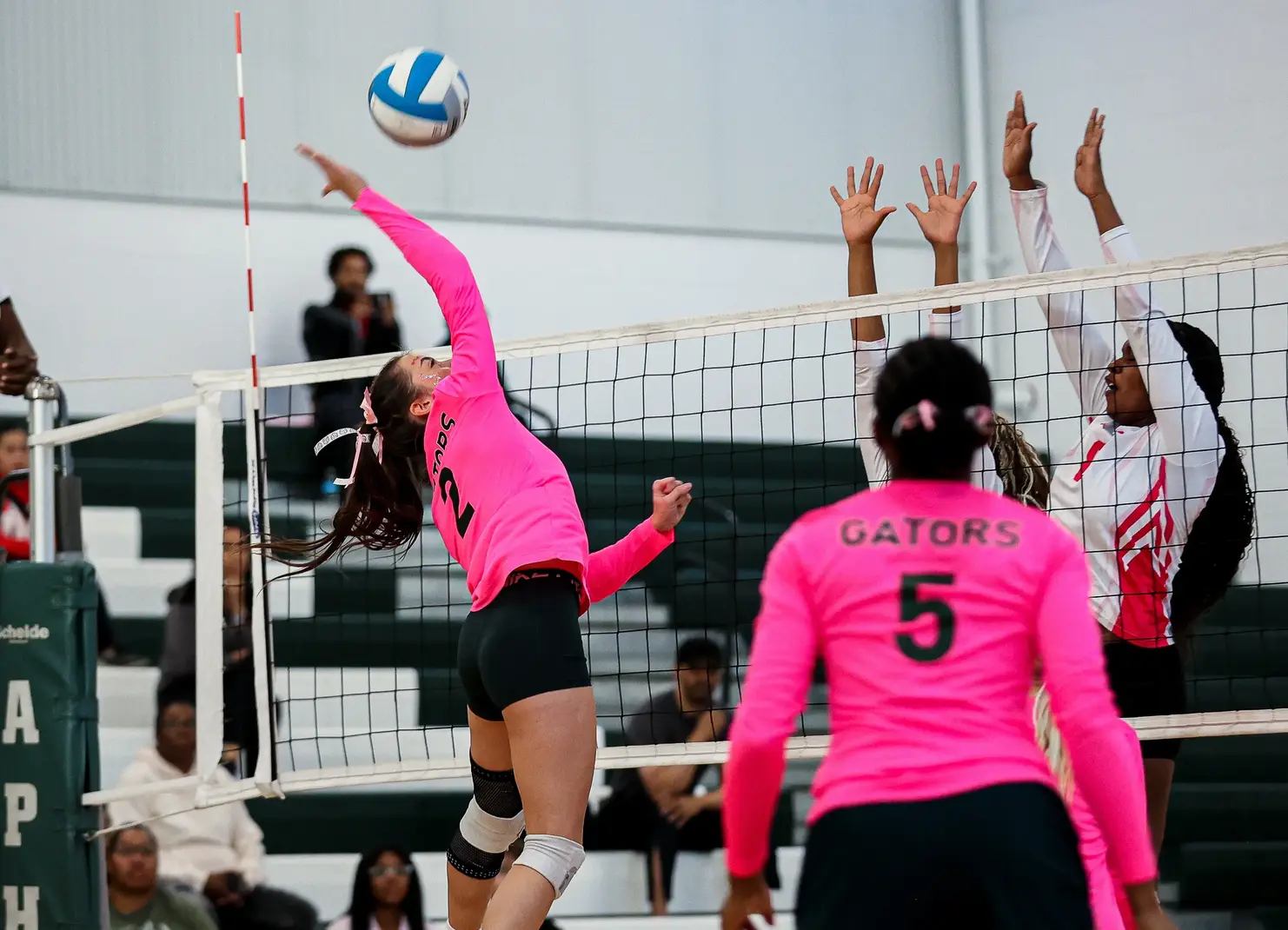 girls playing volleyball