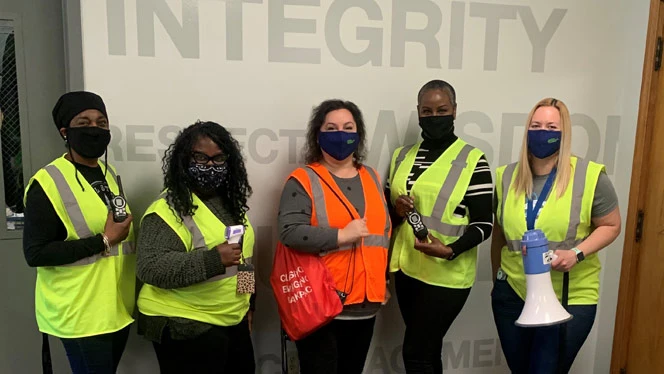 People wearing safety vests. People wearing safety vests.