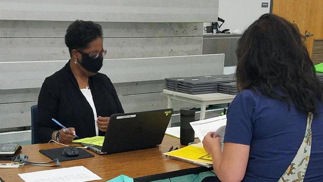 teacher helping parent