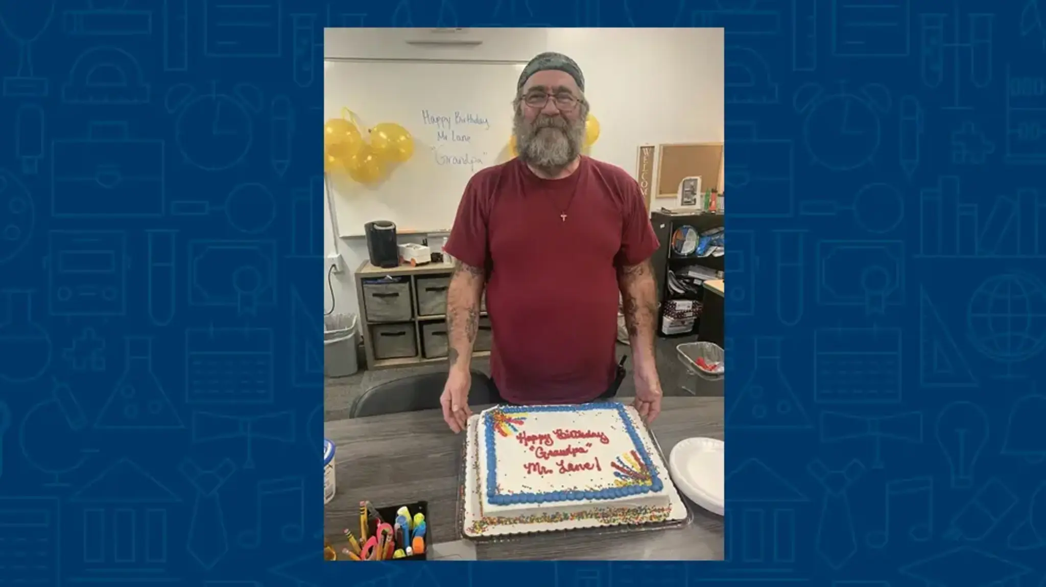 a man standing in front of a cake