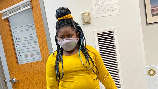 Student wearing yellow.
