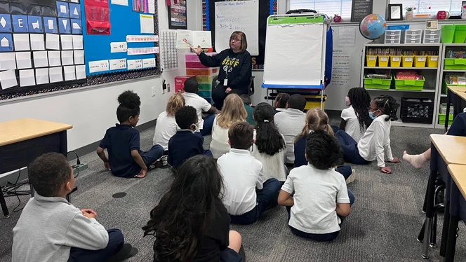 East Arbor teacher Tami Gieske reading to students